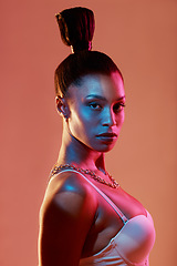 Image showing Neon lighting, fashion and portrait of a woman with makeup isolated on a brown studio background. Cyberpunk, futuristic and face of a model with creative beauty, color and glow on a backdrop