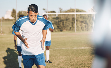 Image showing Soccer, fitness and man on training field with team with focus, mission and mindset for winning game in Brazil. Sports, workout and young professional football player on grass exercise for match