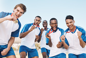 Image showing Man, soccer players and celebration with gold medal for victory, championship or winning match or game. Portrait of happy sporty team celebrating trophy for sports tournament or competition on field