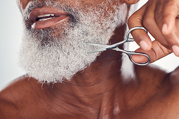 Image showing Trimming, beard and face of a man with a scissors isolated on a white background in a studio. Zoom, hygiene and elderly person cutting facial hair, cleaning and grooming for a treatment on a backdrop