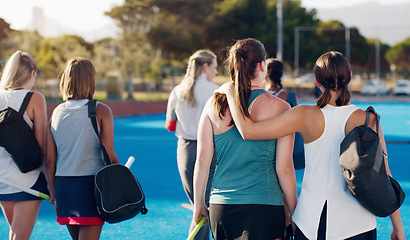 Image showing Women, hockey and teamwork on field together with support, solidarity or walking to fitness training with coach. Sports group, friends and walk from workout, outdoor exercise or hug with conversation