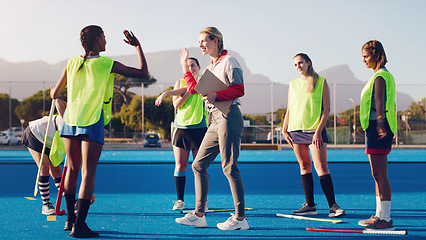 Image showing Hockey, women team with coach and sport, high five and coaching with game strategy, training and fitness on turf outdoor. Athlete stretching, start practice and wellness, motivation and support