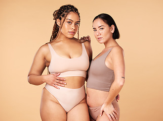 Image showing Confidence, empowerment and portrait of women in underwear isolated on a studio background. Sexy, support and models in lingerie for body positivity, comparison and acceptance on a beige backdrop