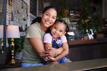 Image showing Portrait, mother and daughter hug in cafe, loving and bonding together on weekend break, smile and joy. Face, mama and girl embrace in coffee shop, happiness and mom show love, relax and quality time