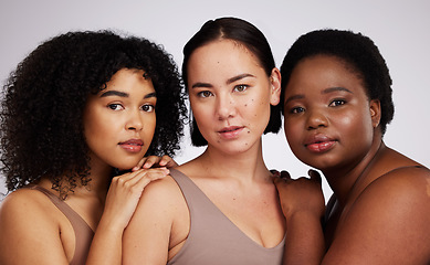 Image showing Portrait, beauty and diversity with woman friends in studio on a gray background together for skincare. Face, makeup and natural with a female model group posing to promote support or inclusion