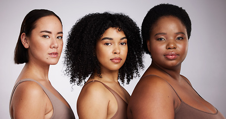 Image showing Women, diversity studio portrait and beauty for aesthetic, care or race equality with plus size solidarity. Model, asian and black woman with cosmetics, makeup and wellness with support by background