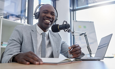 Image showing Portrait, microphone and man on laptop for radio, podcast or business influencer in studio, happy and excited. Face, talk show and host by black guy streaming creative, finance and live audience