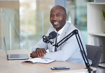 Image showing Podcast, portrait and black man with microphone, radio broadcast or content creation in office, laptop and planning. Virtual reporter, news speaker or journalist speaking on live streaming audio show