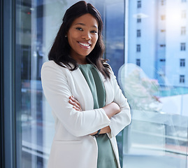 Image showing Window, portrait or black woman arms crossed, smile or confident manager in modern office, leadership or innovation. African American female leader, entrepreneur and ceo with happiness and management