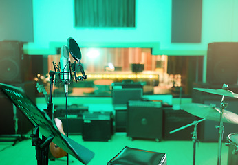 Image showing Music, recording studio and interior with instruments for creative, musician or industry background. Audio technology, microphone and sound production for radio, media and electronics in neon lights