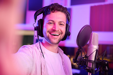 Image showing Musician in recording studio, selfie and portrait with smile, making music with microphone and headphones. Social media content, happy in picture and audio, podcast or radio dj with man face