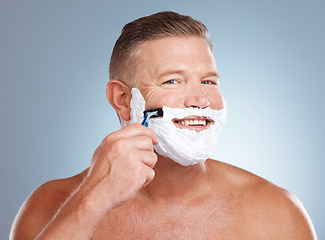 Image showing Shaving, smile and portrait with cream and razor for face cleaning, wellness and skincare. Morning grooming, foam and model with facial care and skin treatment to shave hair in a studio isolated