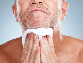 Image showing Skincare, old man and towel to dry beard, dermatology and washing with guy on grey studio background. Face cleaning, senior citizen an mature male with hair care, beauty and cosmetics on backdrop