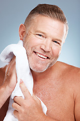 Image showing Man, portrait smile and towel for grooming, skincare or clean shave in hygiene against gray studio background. Happy male smiling with teeth in satisfaction for self love or care for facial treatment