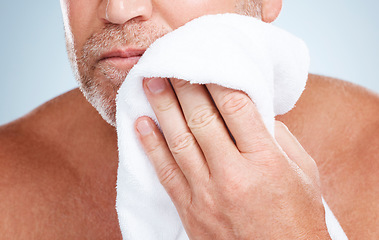 Image showing Closeup, old man and towel to dry face, clean and hygiene for healthy skin, beard and guy on grey studio background. Zoom, senior citizen and mature male with cosmetics cloth, washing and skincare