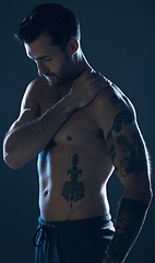 Image showing Fitness, studio and man with tattoo, muscle and strong body for wellness, exercise and training. Motivation, sexy model and body of male athlete on dark background for workout, power and bodybuilder