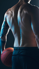 Image showing Sports, body and back of man with ball on black background, isolated with neon blue light and basketball. Fitness, muscle and topless male model in artistic dark studio for workout and gym aesthetic.