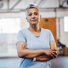 Image showing Senior woman, fitness and portrait at gym after exercise, training or workout. Serious old person with arms crossed for health, wellness and motivation or commitment for healthy lifestyle goals