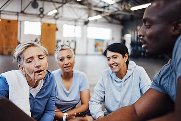 Image showing Fitness, senior women and personal trainer planning health, routine and gym, sign up. Exercise, elderly and friends with coach man on floor for training, discuss and wellness, checklist or membership