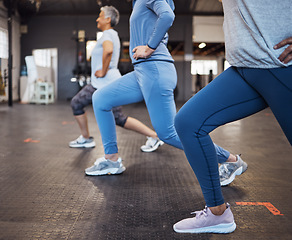 Image showing Stretching, fitness and women doing lunges in the gym for health, team yoga and workout in a class. Legs, exercise and group of people at a club for body training, balance and cardio together