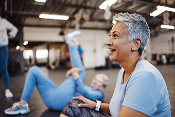 Image showing Happy, fitness and senior woman at the gym for training, exercise and health in retirement. Break, tired and elderly person with a smile after a workout class, cardio or yoga with friends at a club