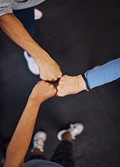 Image showing Teamwork, top view and senior women fist bump for team building, motivation and unity. Support, collaboration and group of elderly friends huddle for trust, union or solidarity, goals or targets.