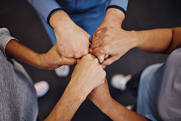 Image showing Hands, teamwork and exercise with sports people standing in a huddle at gym from above for health. Collaboration, support and motivation with a man and woman athlete group in a circle for fitness