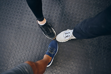 Image showing Group fitness, feet and shoes of people together at gym for exercise, training and a workout together. Above sneakers of men at gym for health and wellness with motivation, teamwork and sports