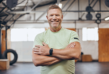 Image showing Fitness, sports and portrait of man in gym with crossed arms for motivation, wellness and cardio workout. Personal trainer, healthy body and face of male for bodybuilder training, exercise and goals