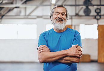 Image showing Motivation, fitness and portrait of Asian man in gym with crossed arms for muscles, wellness and cardio workout. Smile, healthy body and face of senior male after training, exercise and sports goals