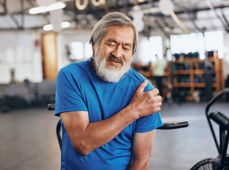 Image showing Sports, gym and shoulder injury, old man in pain and emergency during workout at fitness studio. Health, wellness and inflammation, senior person with hand on muscle cramps while training in Japan.