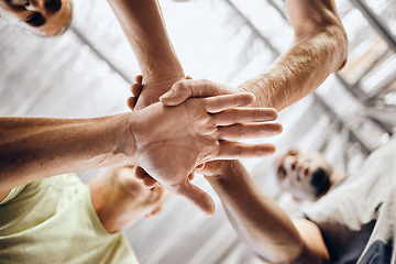 Image showing Hands, stack and fitness huddle in workout gym, training exercise or healthcare wellness bonding. Low angle men, friends and motivation pile in sports teamwork, diversity support or mature community