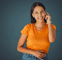 Image showing Young black woman, wireless earphones and wall for music, streaming and audio tech with fashion. Happy gen z girl, earpods and listen with smile for sound quality online in home, house and apartment