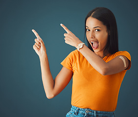 Image showing Pointing, vaccine and portrait of woman in studio for covid, injection or healthcare on mockup or grey background. Health, girl and model with plaster for corona, shot or immunity isolated copy space