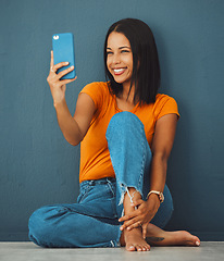 Image showing Black woman, floor and home with smile for selfie fashion clothes or relax with beauty by wall background. Gen z girl, smartphone and happy in house with feet, jeans or face photo for profile picture