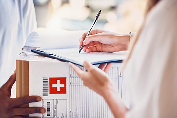 Image showing Delivery, signature and box parcel for a customer for an online order or ecommerce medicine shopping. Cargo, shipping and courier driver giving a medical package to a woman for signage at front door.