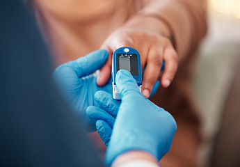 Image showing Closeup of hand, pulse device on finger and doctor checkup for blood oxygen level measurement. Medical professional testing in clinic, healthcare with digital meter or nurse consulting african woman