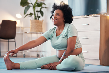 Image showing Yoga, pregnant and black woman stretching legs in home for flexibility, health or fitness. Pregnancy, zen pilates and future mother or mama thinking while training, exercise or workout for wellness.