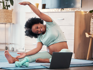 Image showing Laptop, pregnant black woman and yoga stretching in home for fitness, wellness and health. Zen, pregnancy and future mom or mother with computer for virtual training or streaming online pilates class