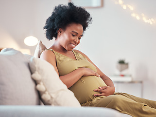 Image showing Pregnant, love and black woman on sofa in home with hope and care for unborn baby. Pregnancy, prenatal motherhood and mama or future mother relax in living room and touching belly for infant health.