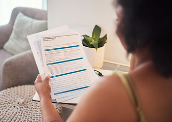 Image showing Paperwork, health insurance and woman reading in her house for healthcare hospital treatment. Planning, home and African female analyzing a medical document in the living room of her apartment.