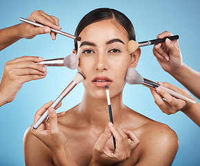 Image showing Portrait, woman and brushes for makeup, skincare and dermatology with lady on blue studio background. Face, female and girl with cosmetics tools, natural beauty and foundation for glow and soft skin