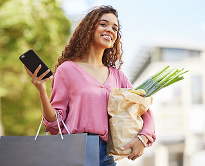 Image showing Smartphone, woman and shopping with bags, outdoor and purchase groceries with smile, sale and discount items. Female shopper, customer and lady with online deals, waiting for taxi and retail products