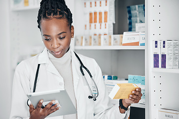 Image showing Tablet, pharmacy and pharmacist doing research on medication or pill box for treatment or cure. Healthcare, pharmaceutical and black woman chemist checking prescription medicine in a drugstore.