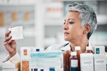 Image showing Pharmacy, stock and senior woman pharmacist with box, pills and medication, reading and checking information. Elderly lady, drugstore and health expert doing inventory check on treatment or product