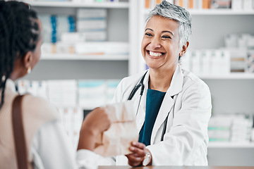 Image showing Senior pharmacist with pills for a sick black woman in a pharmacy for retail healthcare treatment. Smile, trust or happy mature doctor helping a customer shopping for medication, medicine or drugs