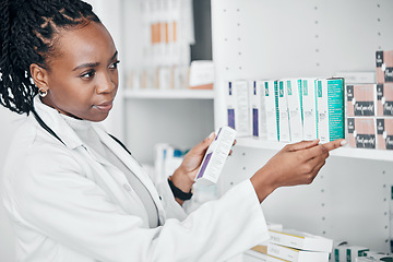 Image showing Pharmacy, pills and medicine with black woman in store for healthcare, wellness or retail. Product, prescription and medical with pharmacist at drugs outlet for shopping, supplements or inventory