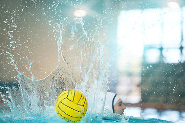 Image showing Water polo, ball and splash with athlete in swimming pool training, exercise and fitness game or sports event. Professional swimmer, person or woman in competition, challenge stroke and object action