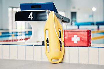 Image showing Swimming pool, medical and lifeguard equipment for water safety, security or emergency for rescue. Safe swim tools for first aid help, protection and lifebuoy in preparation for rescuing or lifesaver