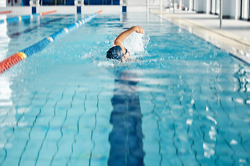 Image showing Athlete, breathing or freestyle stroke in swimming pool cap for sports wellness, training or exercise for body healthcare. Workout, fitness and swimmer man in motion for water competition challenge